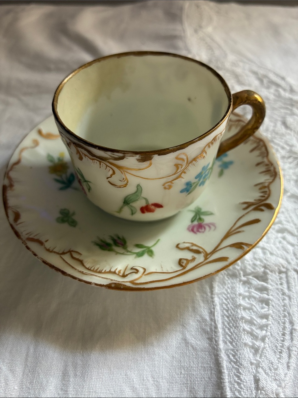 Royal Albert White Cup and Saucer with Gold Trim and Multicolor Floral Accents